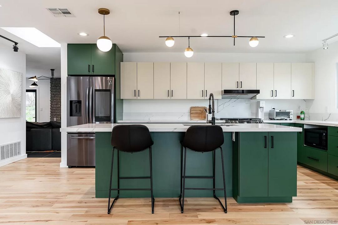 Custom kitchen remodel on Trinidad Way CA with green and cream cabinetry by Concepts by Design